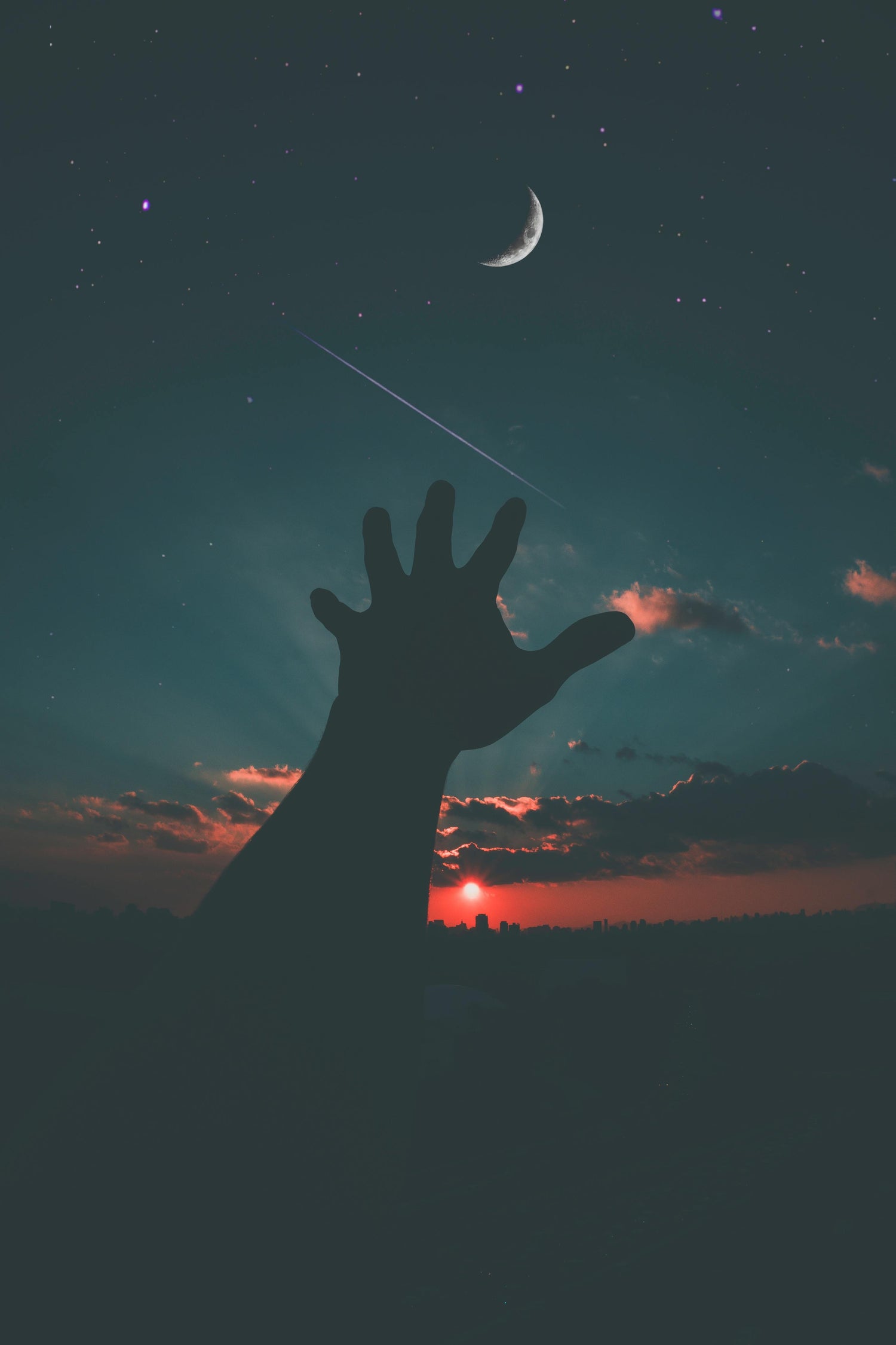 Creative image of a hand reaching out to the cosmos