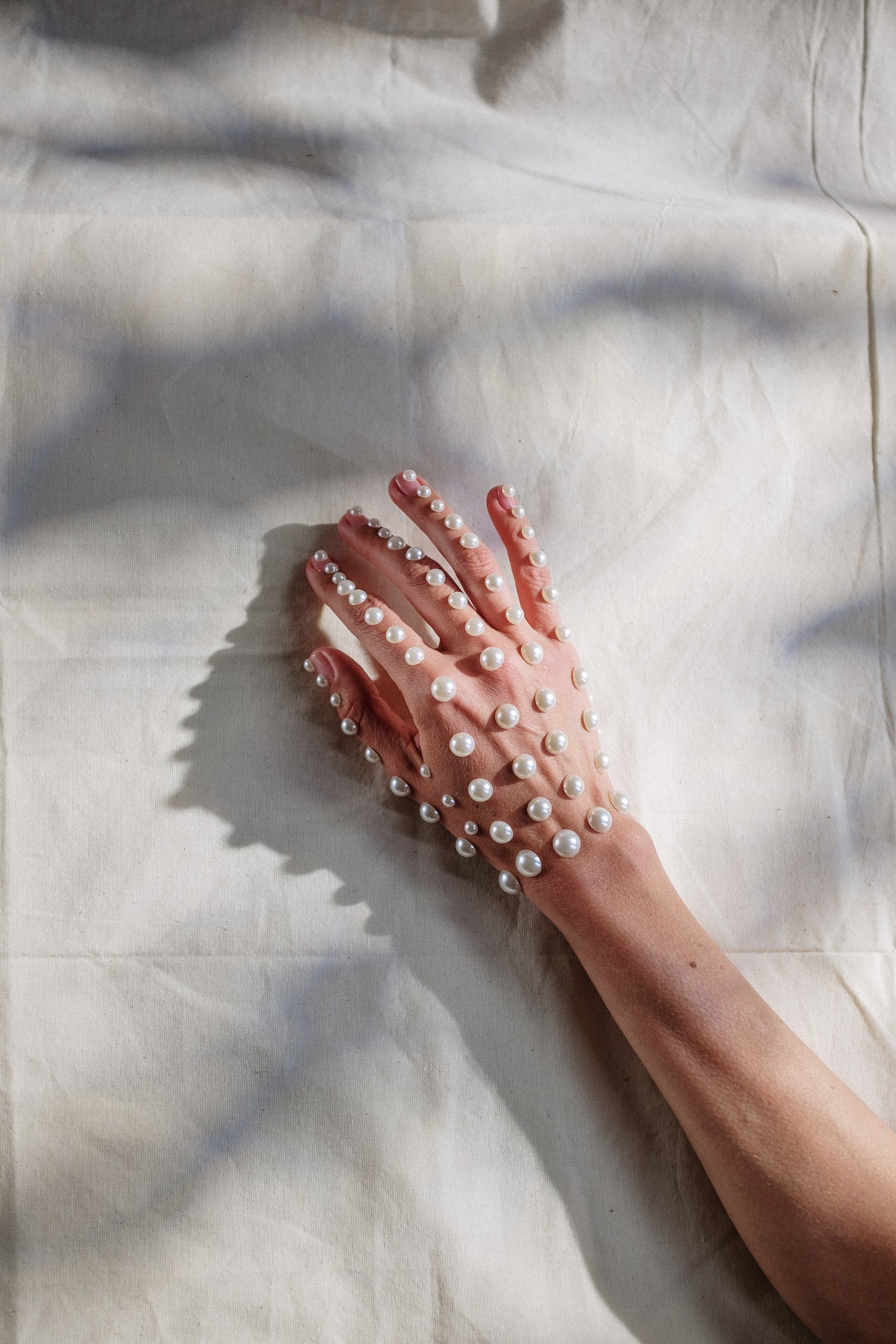 pearls placed on a hand