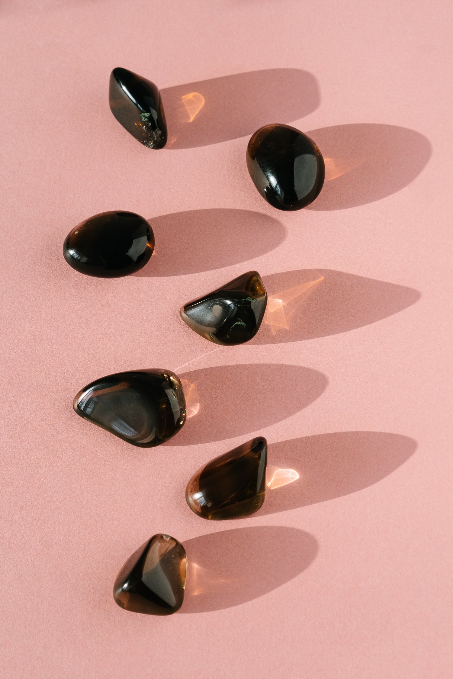 Polished black-coloured gemstones